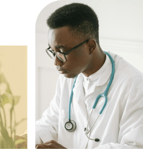 African American doctor in lab coat looking concerned, representing stress, responsibility, and emotional burden at work
