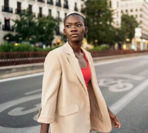 High-achieving African American woman walking confidently toward healing with trauma therapists in Midtown Manhattan, NYC