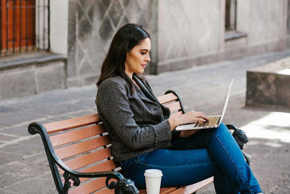 mexican woman working with her laptop