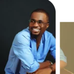 Portrait of a cheerful professional man wearing glasses and a blue shirt.