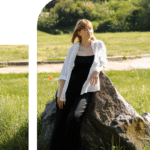 Woman with blonde hair leaning against a large rock in a grassy park on a sunny day.