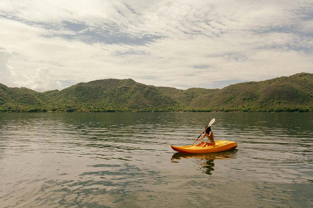 Kayaker paddling on calm water